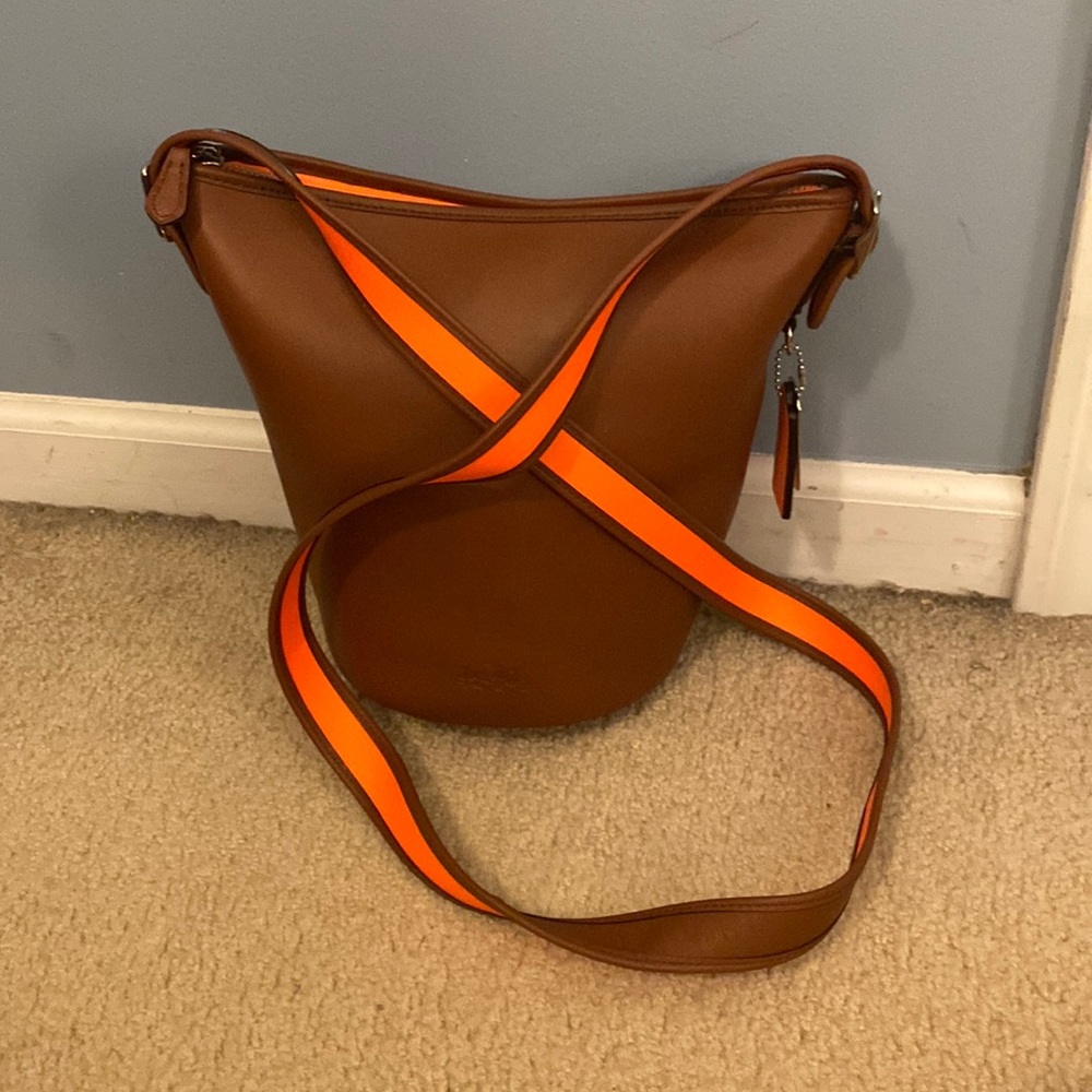 Coach crossbody. Brown leather with neon orange accent.